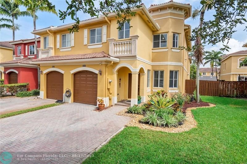 front view of a house with a garden