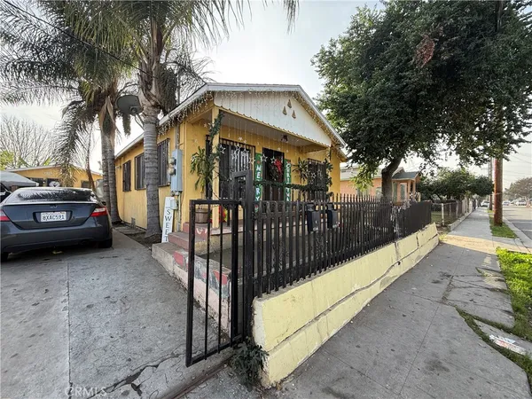 a view of a car park in front of a house