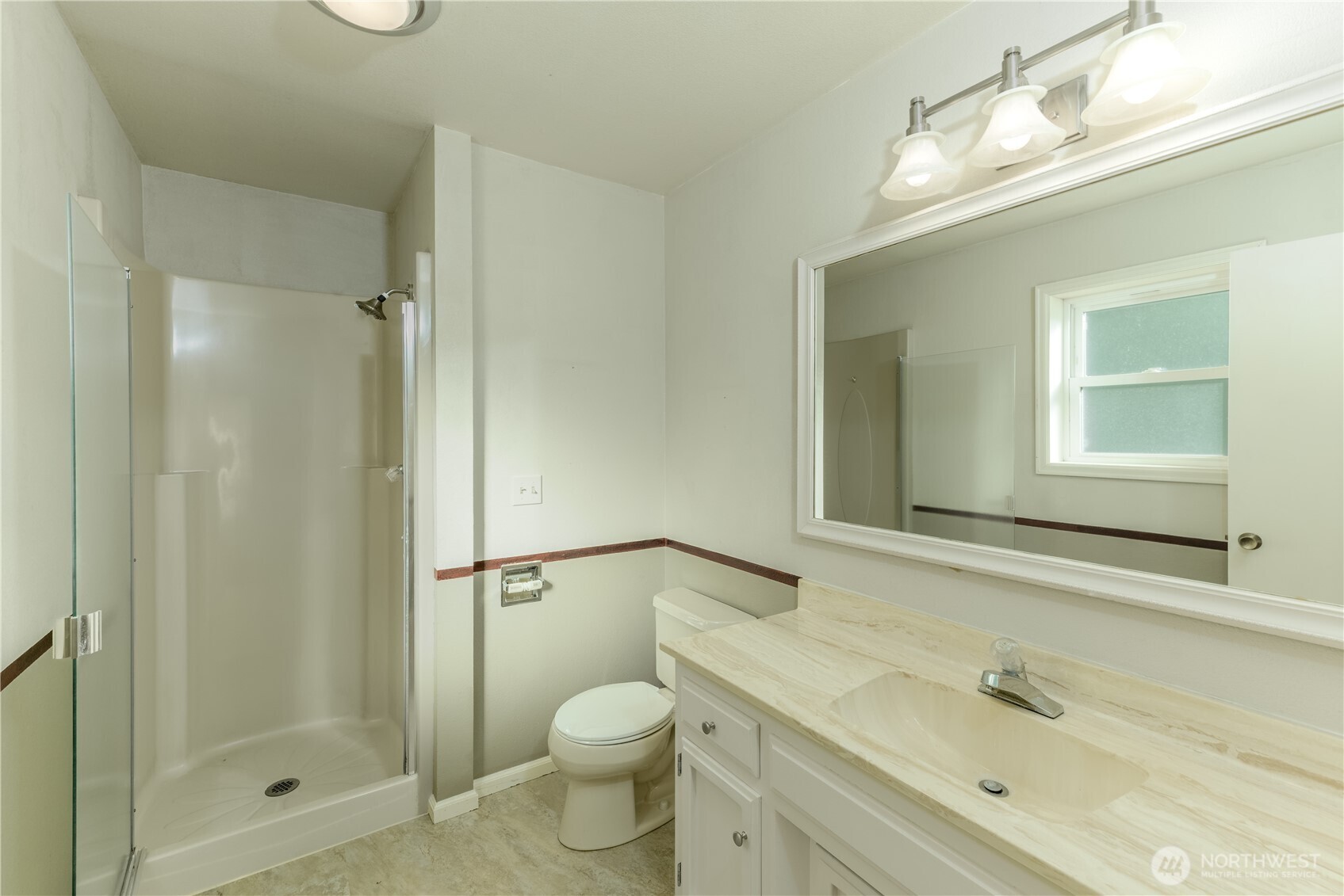 103 Turnagain Place Sequim, WA 98382 - Photo 23 of 40 a bathroom with a granite countertop sink toilet and shower