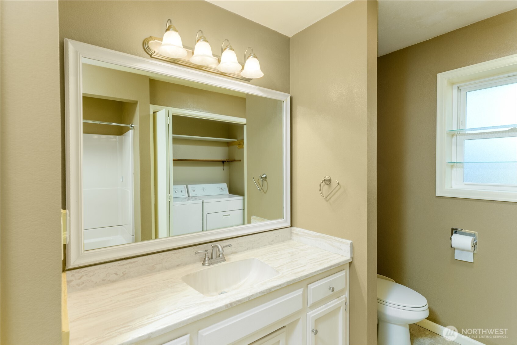 103 Turnagain Place Sequim, WA 98382 - Photo 26 of 40 a bathroom with a sink vanity mirror and toilet