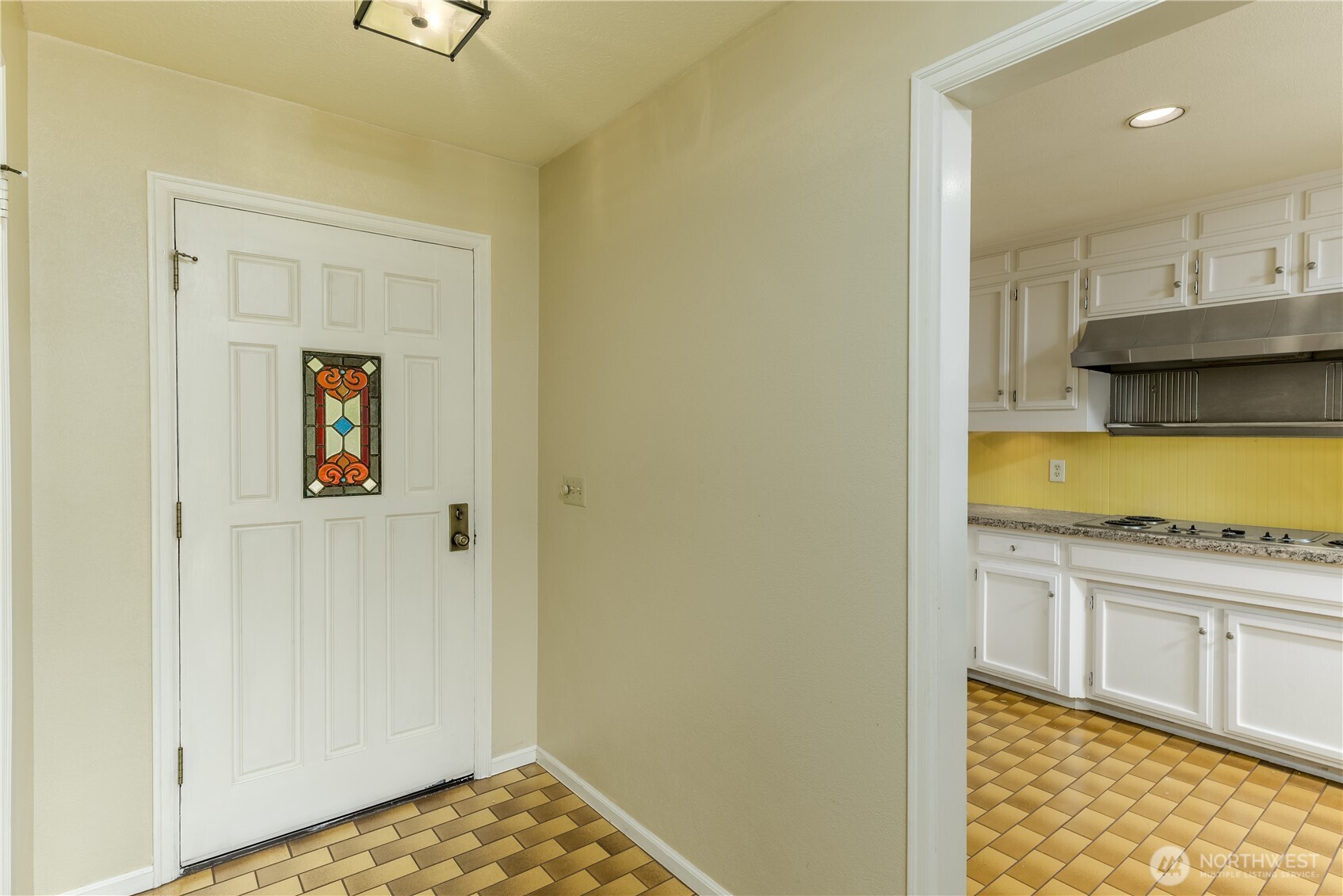 103 Turnagain Place Sequim, WA 98382 - Photo 4 of 40 a kitchen with a stove and a refrigerator