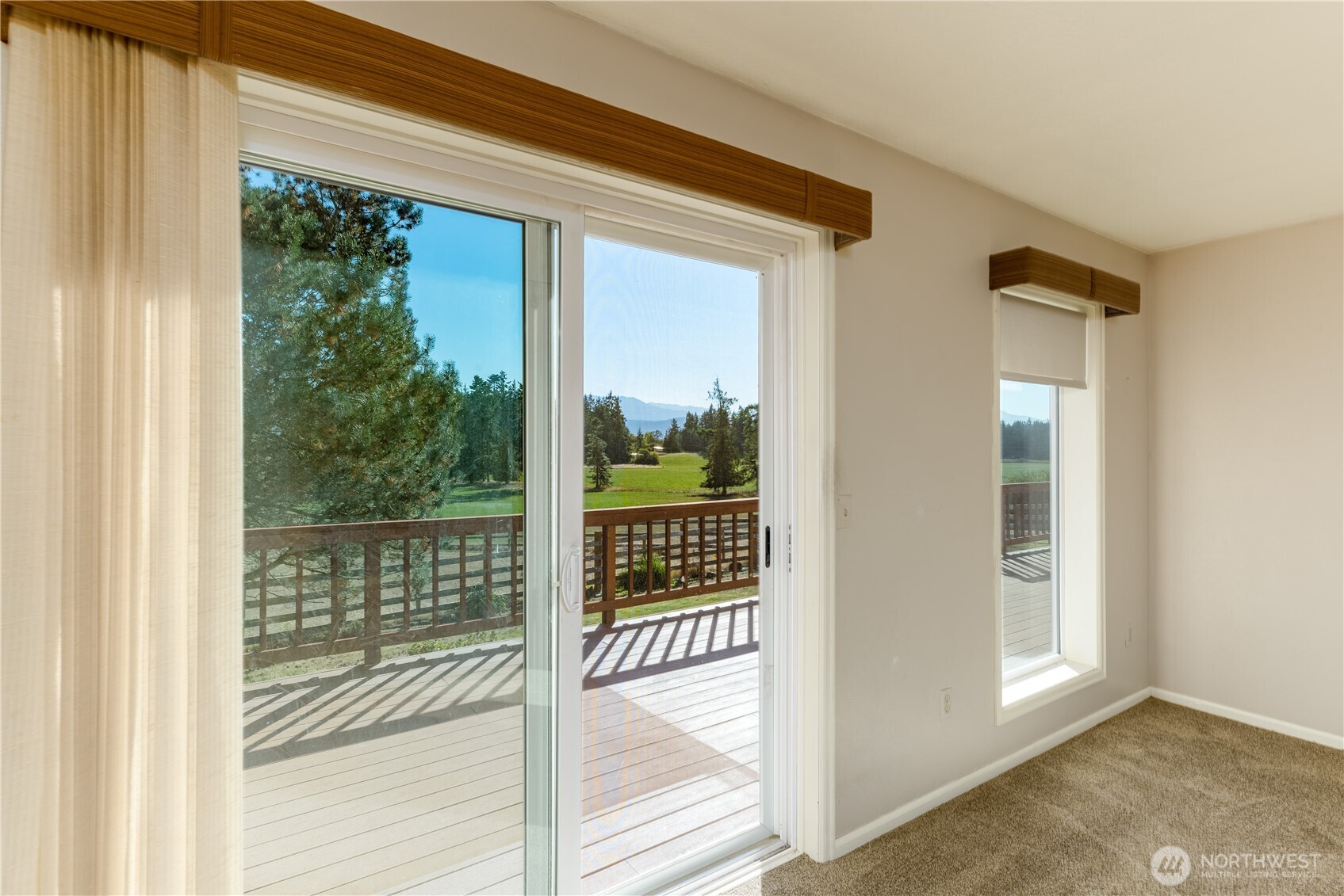 103 Turnagain Place Sequim, WA 98382 - Photo 7 of 40 a view of a glass door and a window