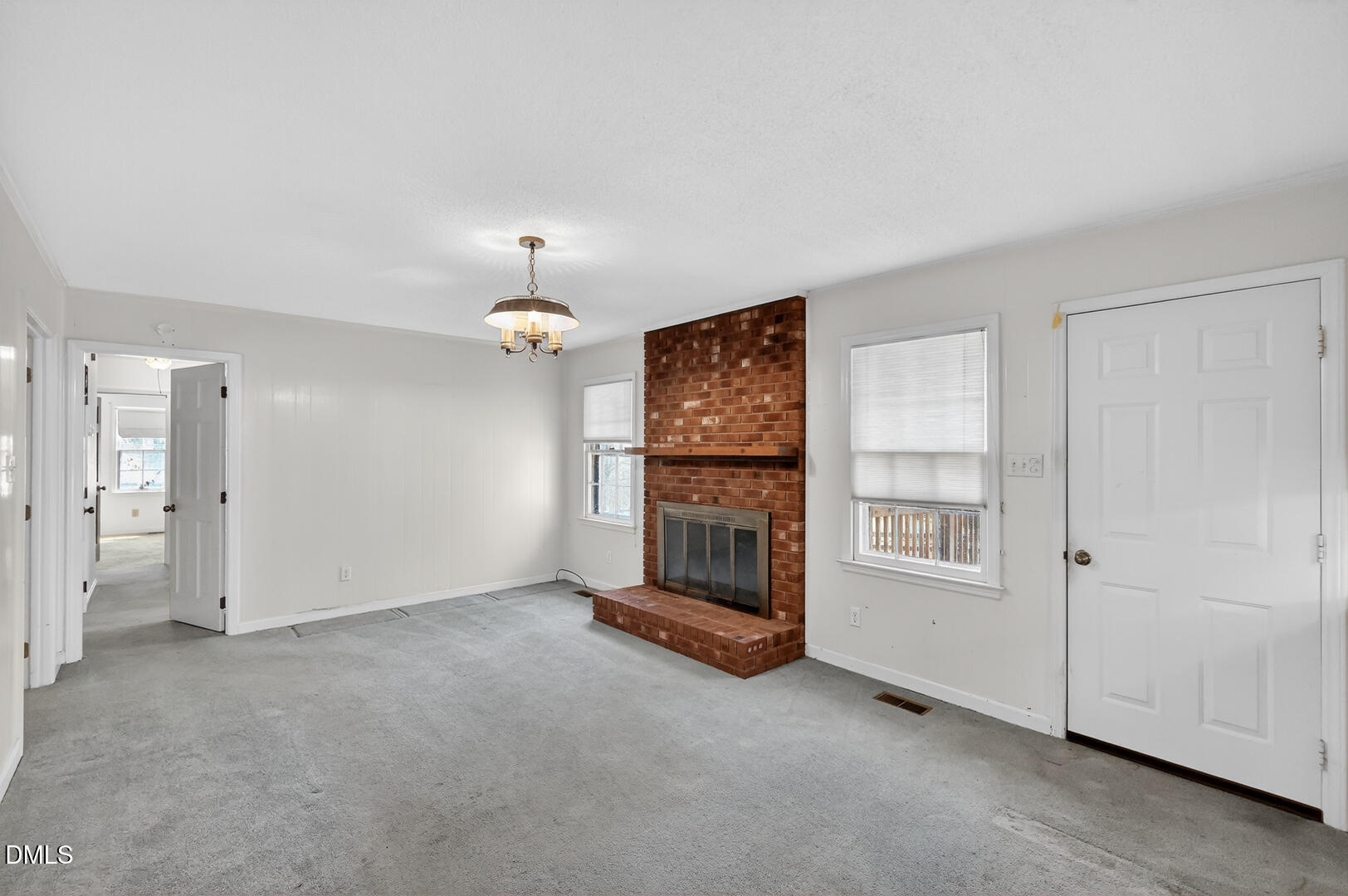 1620 Wait Avenue Wake Forest, NC 27587 - Photo 37 of 55 an empty room with chandelier fan and windows