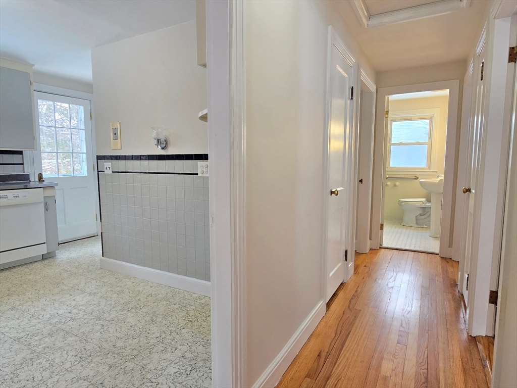 37 Riverview Drive Ashland, MA 01721 - Photo 18 of 30 a view of a hallway with wooden floor and closet