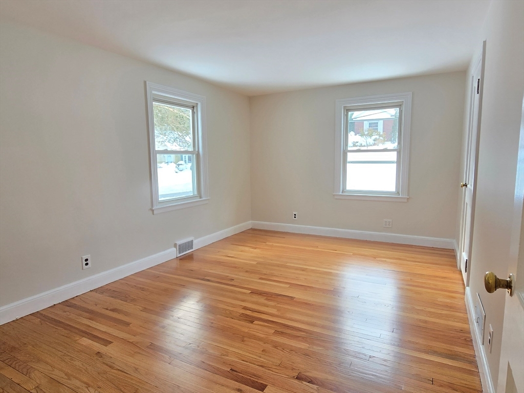 37 Riverview Drive Ashland, MA 01721 - Photo 21 of 30 a view of empty room with wooden floor and fan