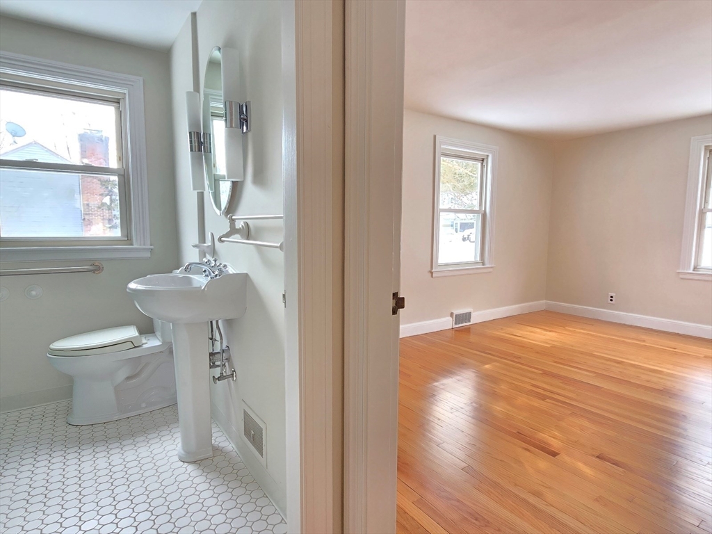 37 Riverview Drive Ashland, MA 01721 - Photo 23 of 30 a bathroom with a sink toilet and a window