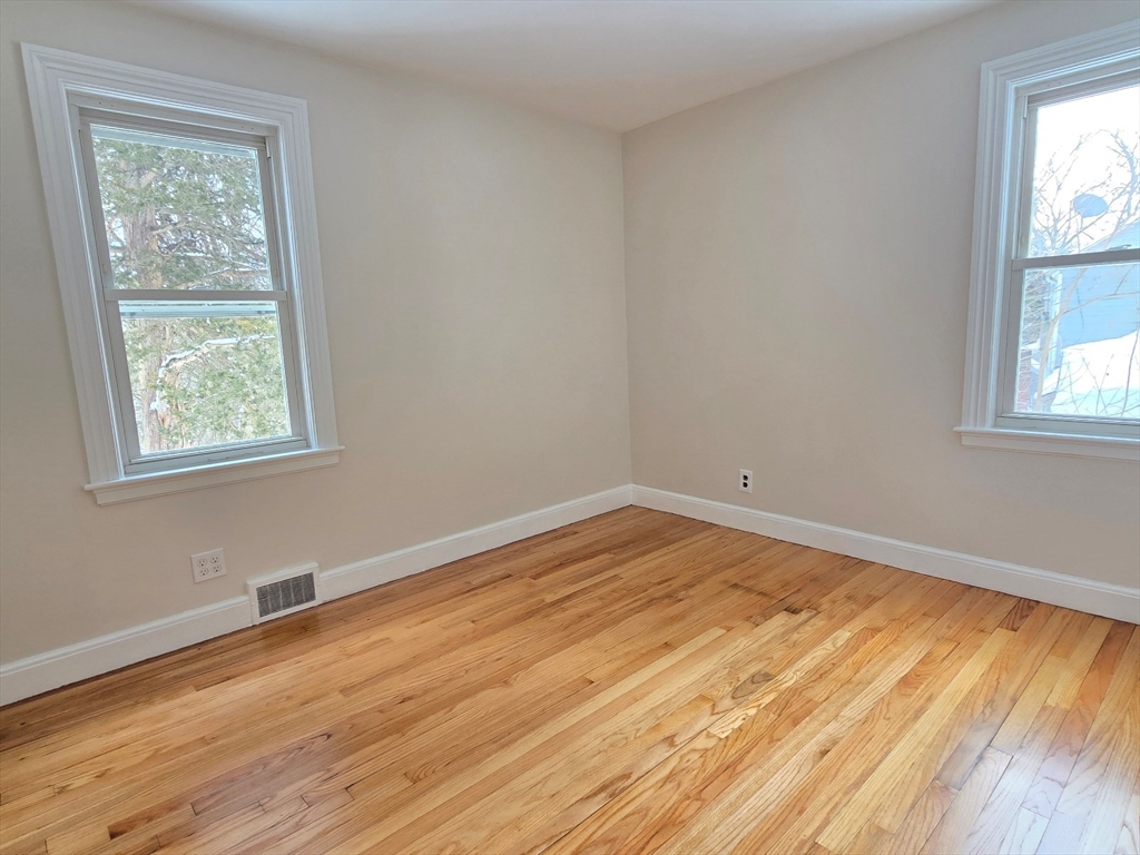 37 Riverview Drive Ashland, MA 01721 - Photo 25 of 30 a view of empty room with wooden floor and fan