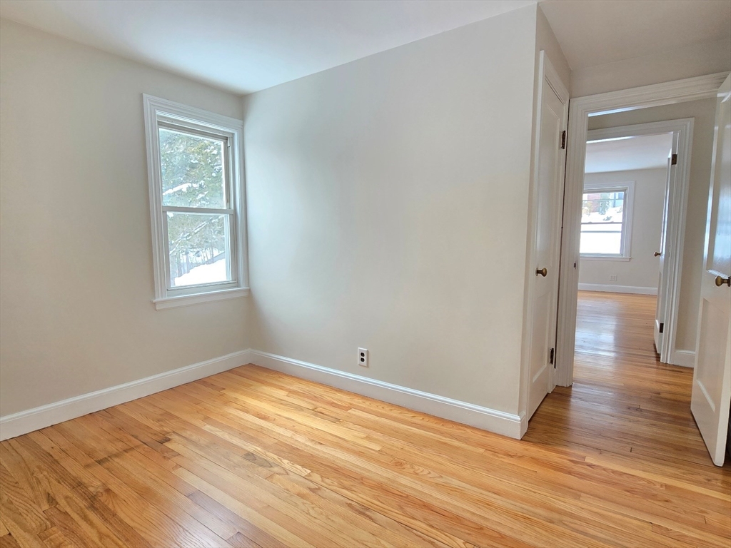 37 Riverview Drive Ashland, MA 01721 - Photo 26 of 30 wooden floor in an empty room with a window