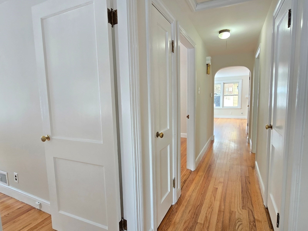 37 Riverview Drive Ashland, MA 01721 - Photo 27 of 30 a view of a hallway with wooden floor