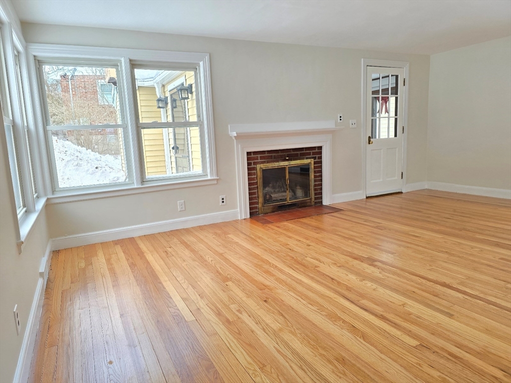 37 Riverview Drive Ashland, MA 01721 - Photo 7 of 30 a view of an empty room with a window and wooden floor