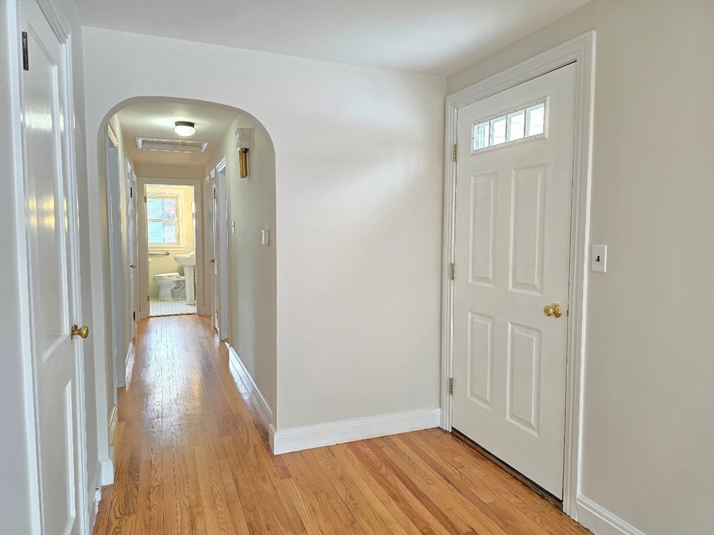 37 Riverview Drive Ashland, MA 01721 - Photo 8 of 30 a view of a hallway with wooden floor