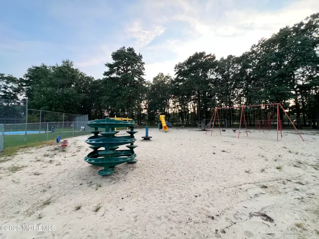 a view of a park with large trees