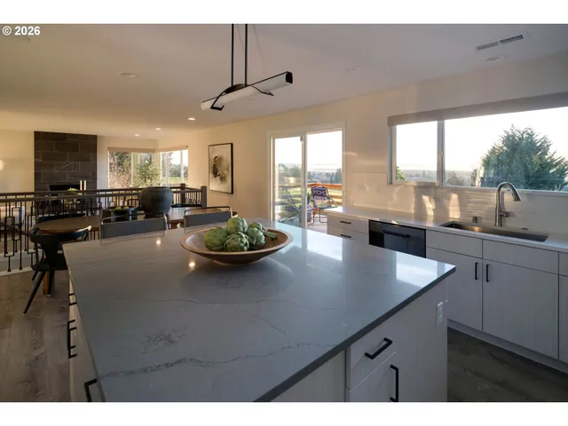 a view of kitchen and dining room with wooden floor