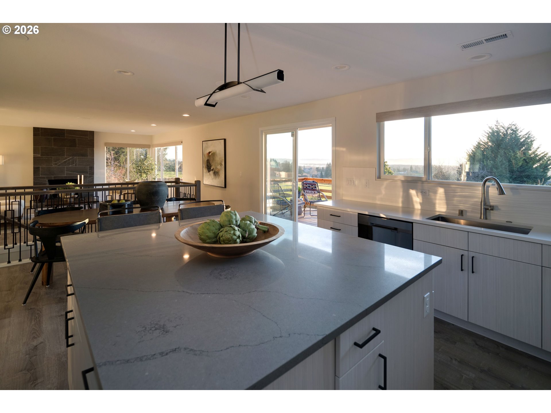 6409 Northwest 202nd Circle Ridgefield, WA 98642 - Photo 15 of 39 a view of kitchen and dining room with wooden floor