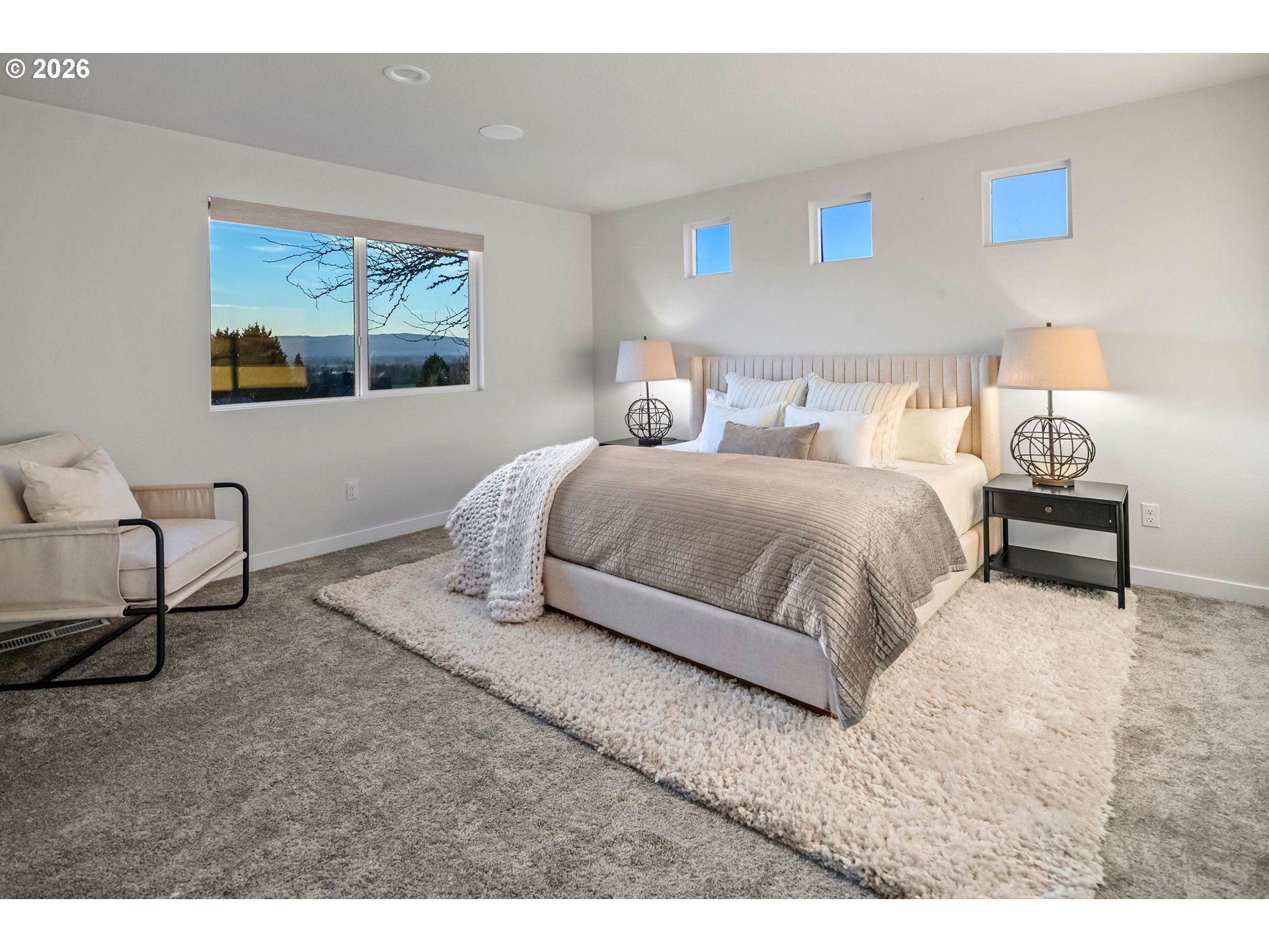 6409 Northwest 202nd Circle Ridgefield, WA 98642 - Photo 17 of 39 a bedroom with a bed and wooden floor