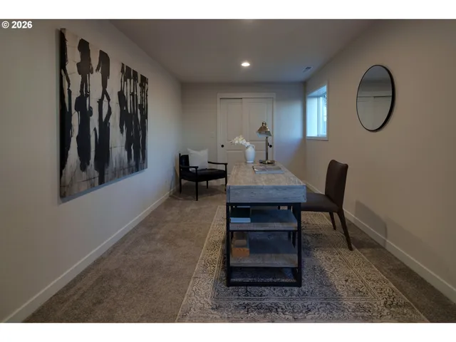 a living room with furniture a mirror and a window