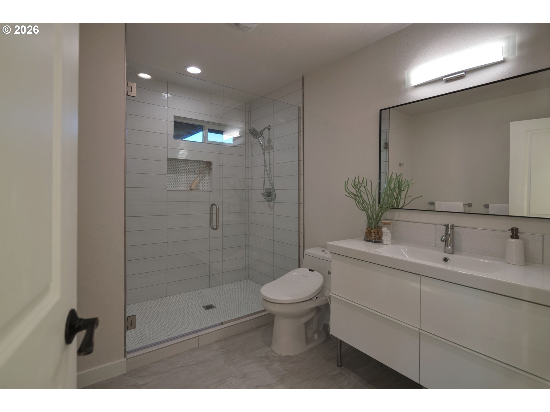 6409 Northwest 202nd Circle Ridgefield, WA 98642 - Photo 26 of 39 a bathroom with a toilet sink and a mirror