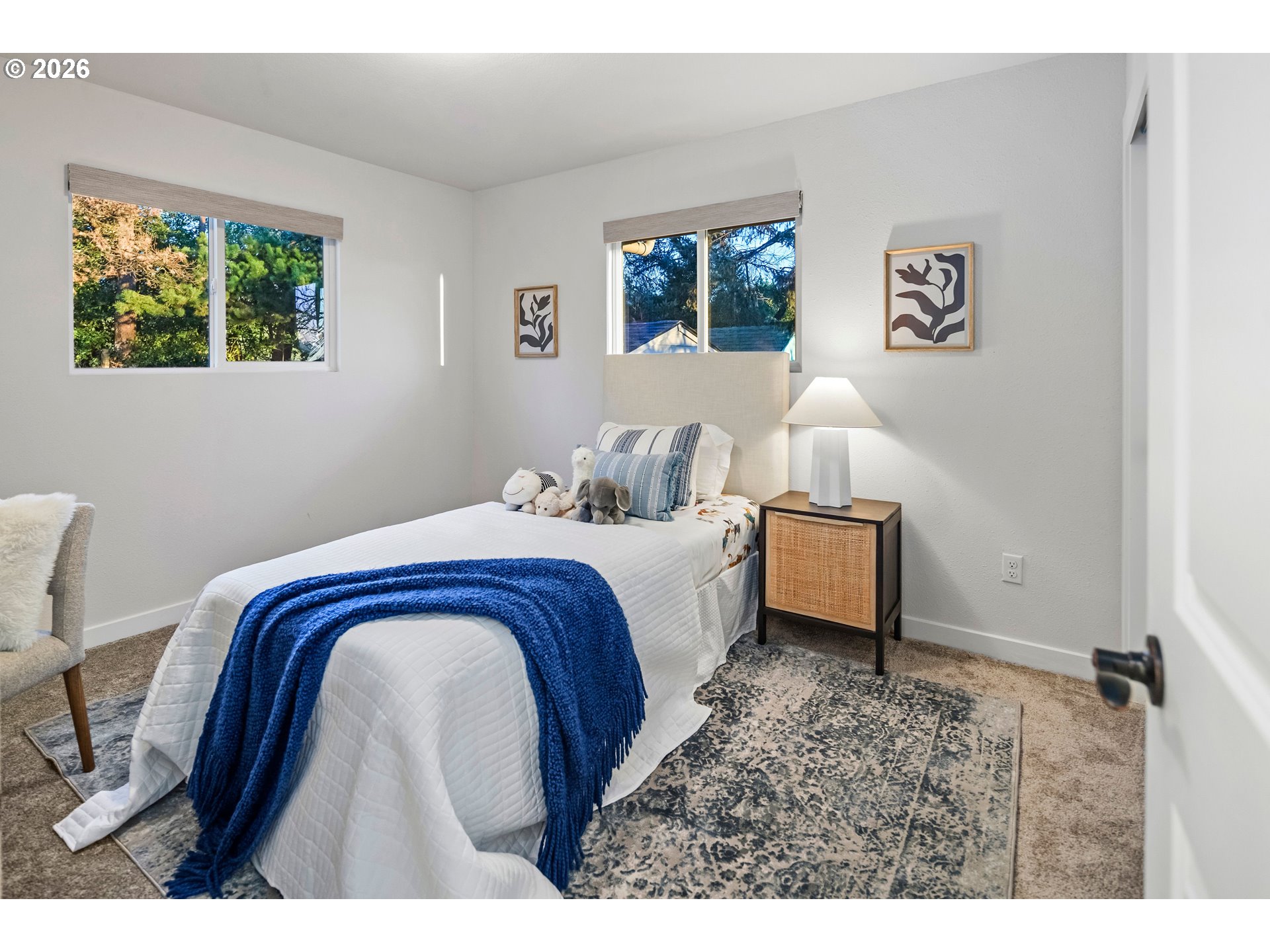 6409 Northwest 202nd Circle Ridgefield, WA 98642 - Photo 27 of 39 a bedroom with a bed and a painting on the wall