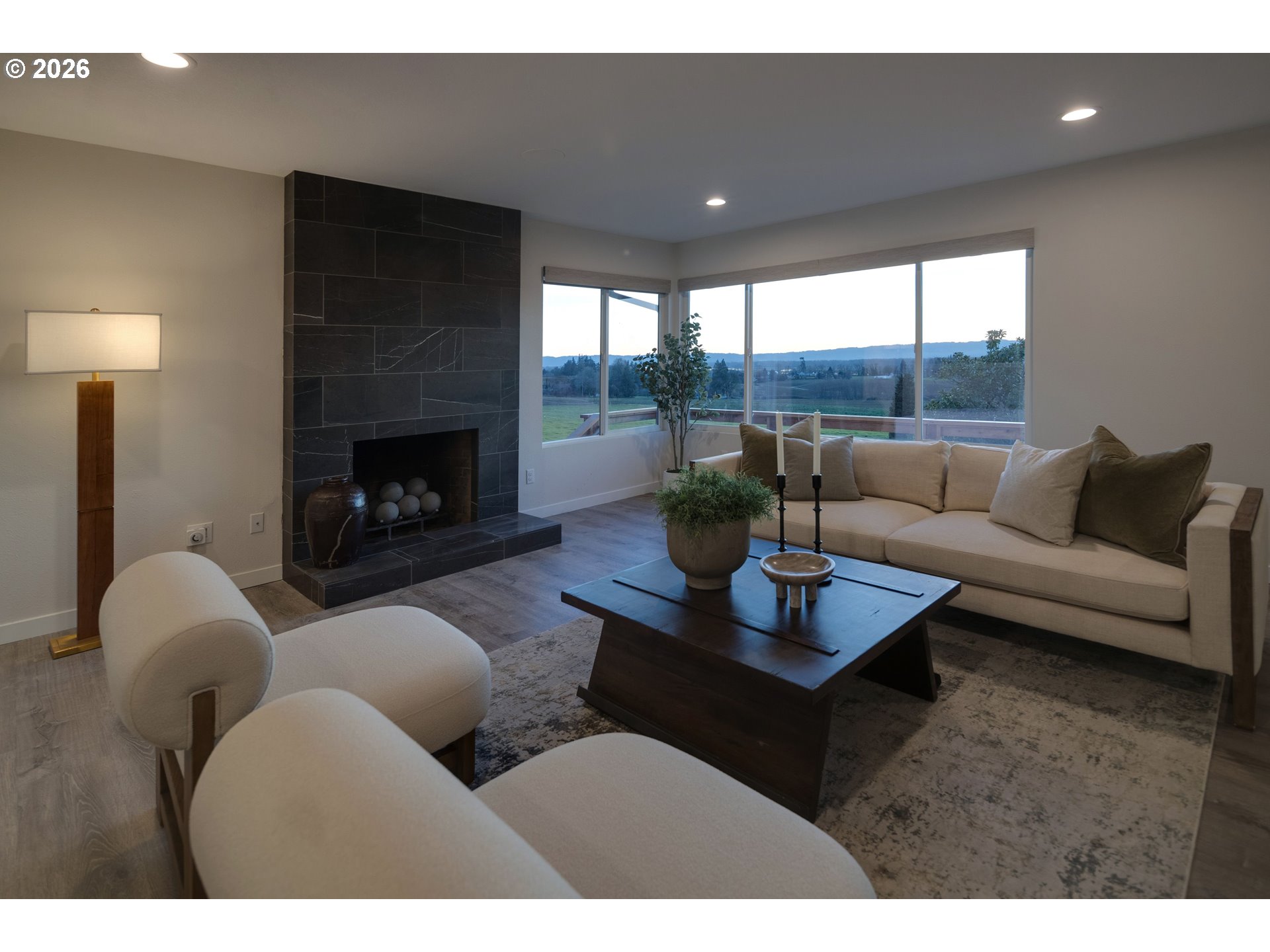 6409 Northwest 202nd Circle Ridgefield, WA 98642 - Photo 6 of 39 a living room with furniture and a fireplace