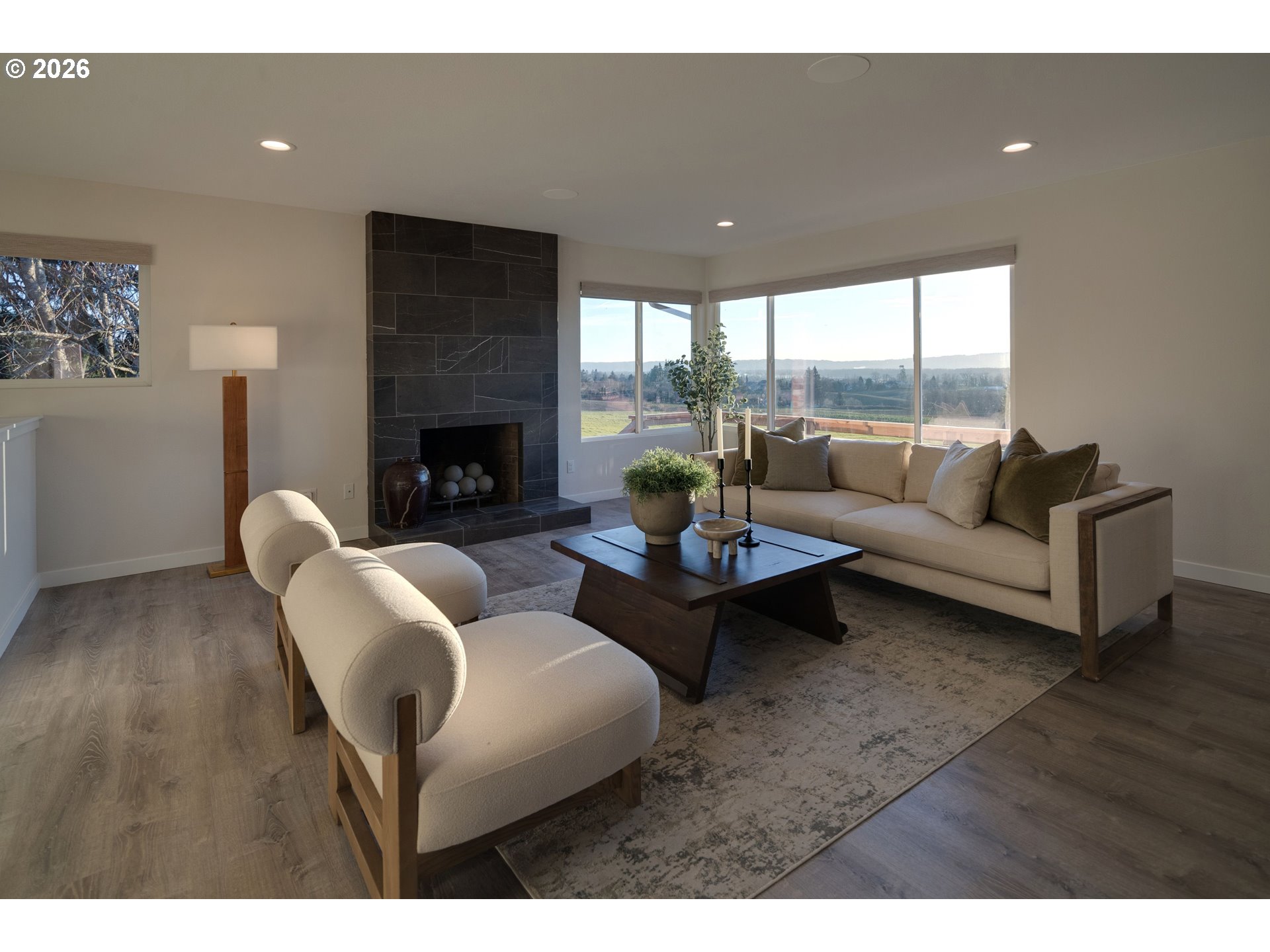 6409 Northwest 202nd Circle Ridgefield, WA 98642 - Photo 7 of 39 a living room with furniture and a fireplace