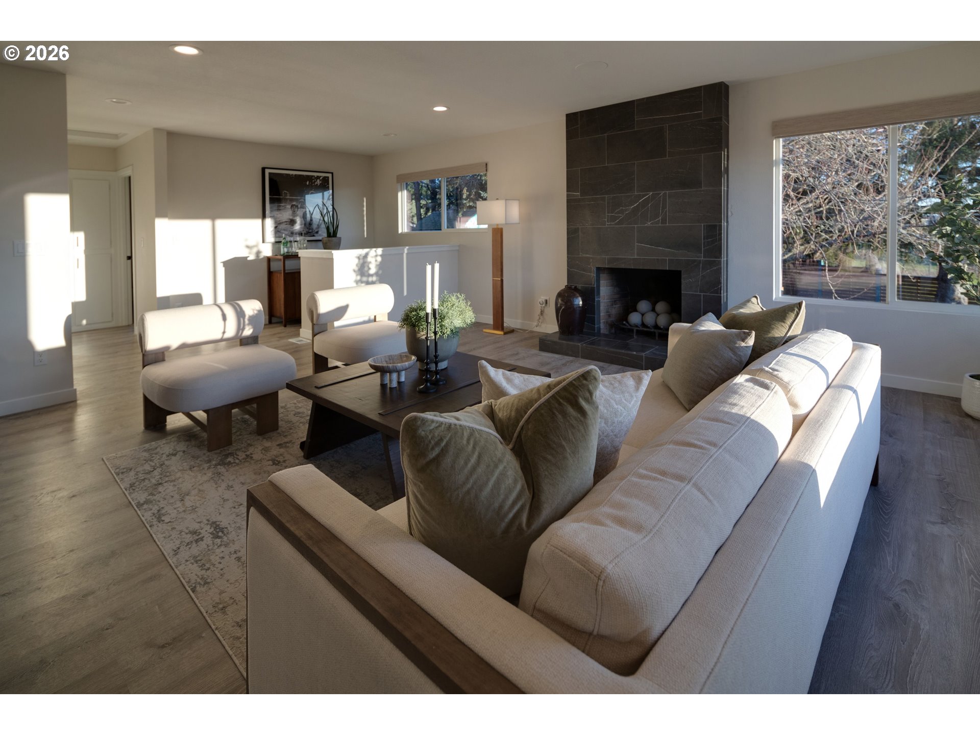 6409 Northwest 202nd Circle Ridgefield, WA 98642 - Photo 8 of 39 a living room with furniture fireplace and a large window