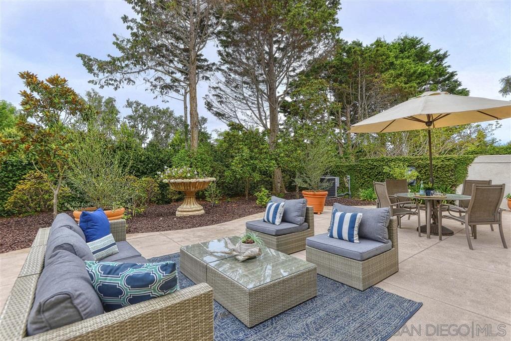 9660 Claiborne Square La Jolla, CA 92037 - Photo 13 of 23 a outdoor living space with furniture and a garden