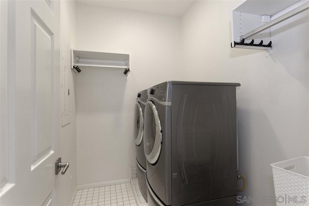 9660 Claiborne Square La Jolla, CA 92037 - Photo 21 of 23 a bathroom with a glass shower door