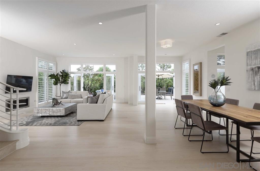 9660 Claiborne Square La Jolla, CA 92037 - Photo 5 of 23 a dining room with furniture and wooden floor