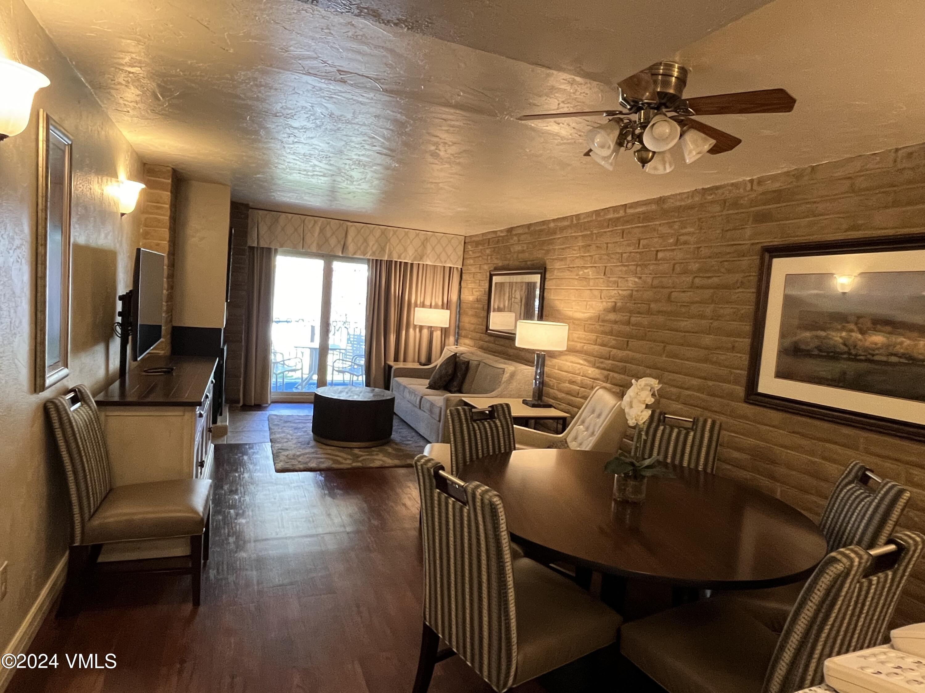 1020 Vail View Drive, Unit 120536 Vail, CO 81657 - Photo 1 of 23 a living room with furniture and a flat screen tv
