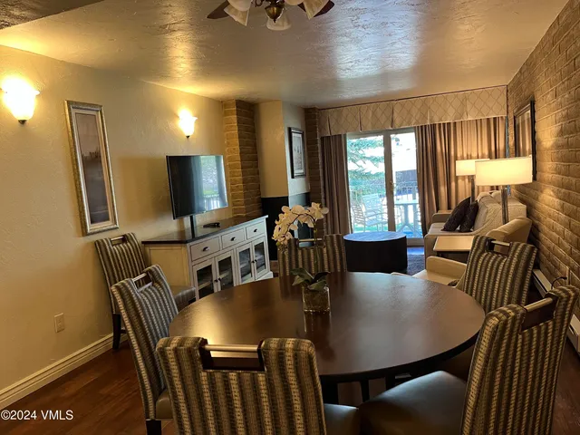 a view of a dining room with furniture window and outside view