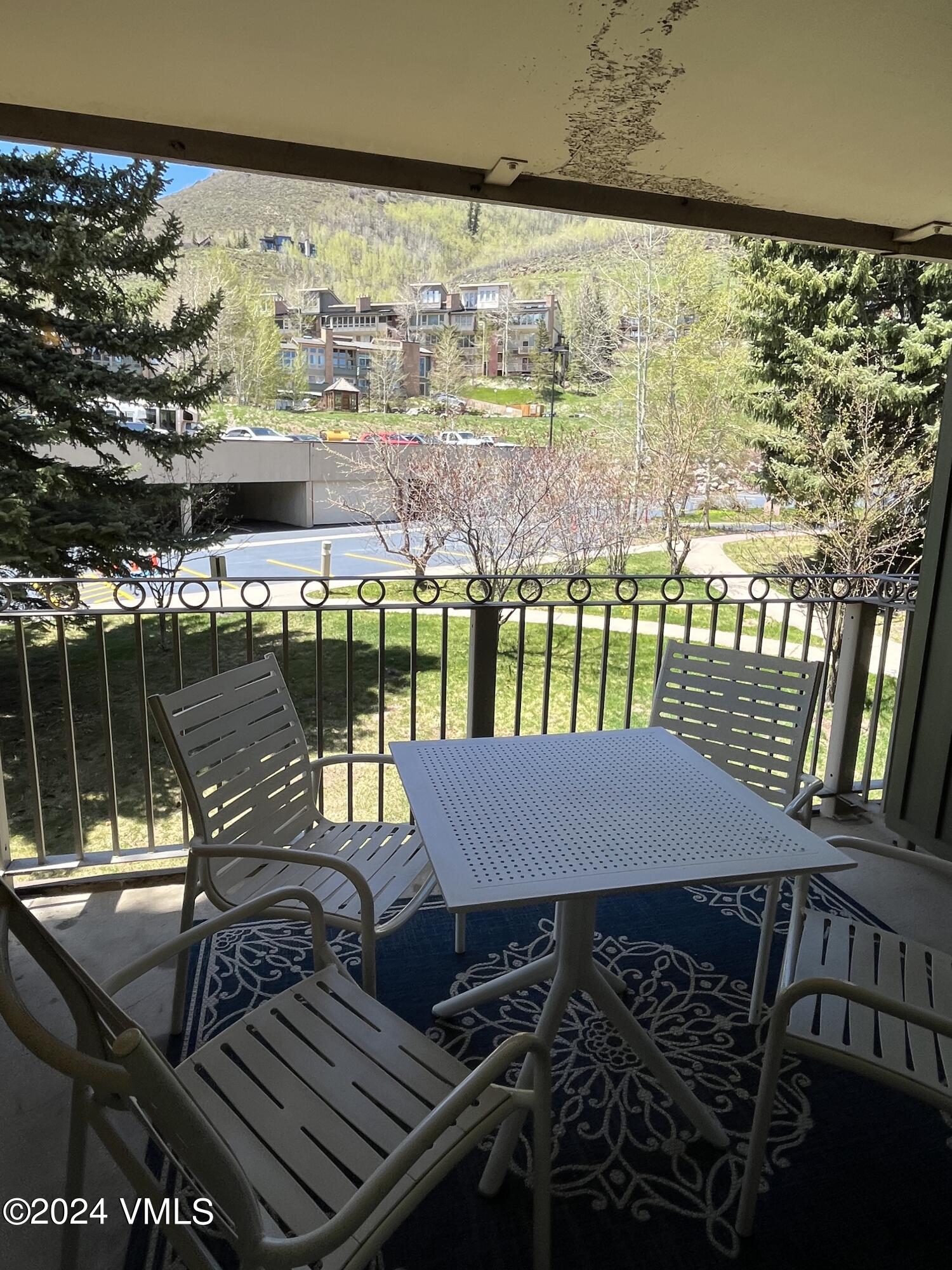 1020 Vail View Drive, Unit 120536 Vail, CO 81657 - Photo 5 of 23 a view of a balcony with two chairs and a table