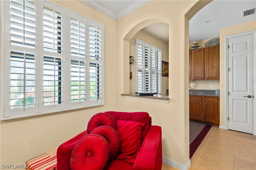 1387 Santiago Circle, Unit 802 Naples, FL 34113 - Photo 15 of 29 a living room with furniture and a window