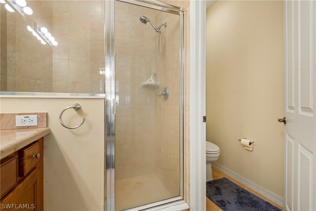 1387 Santiago Circle, Unit 802 Naples, FL 34113 - Photo 21 of 29 a bathroom with a shower