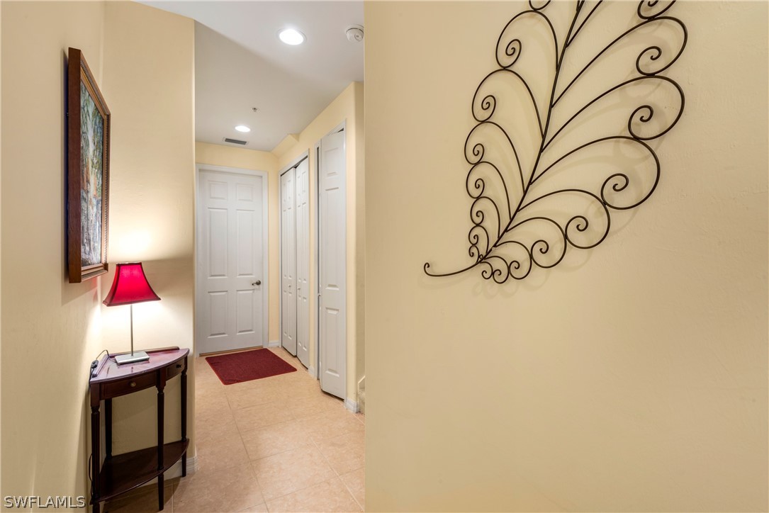 1387 Santiago Circle, Unit 802 Naples, FL 34113 - Photo 23 of 29 a view of entryway and front door
