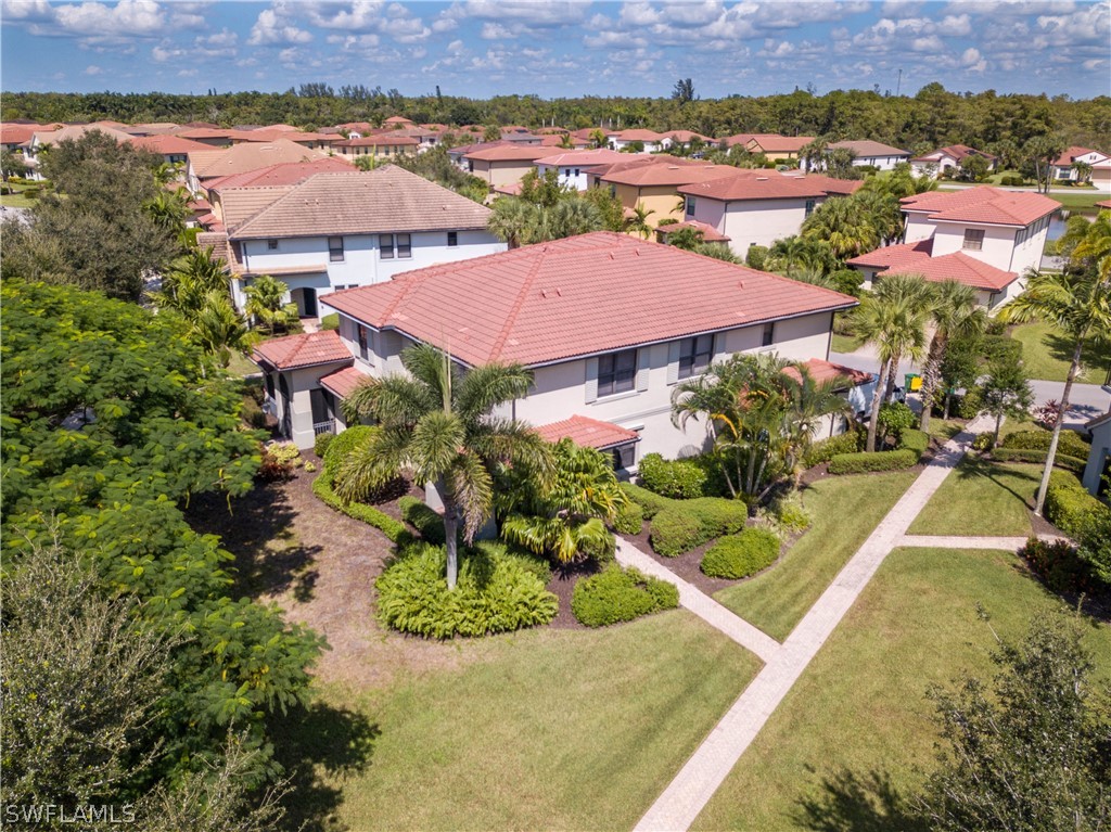 1387 Santiago Circle, Unit 802 Naples, FL 34113 - Photo 3 of 29 an aerial view of residential houses with outdoor space