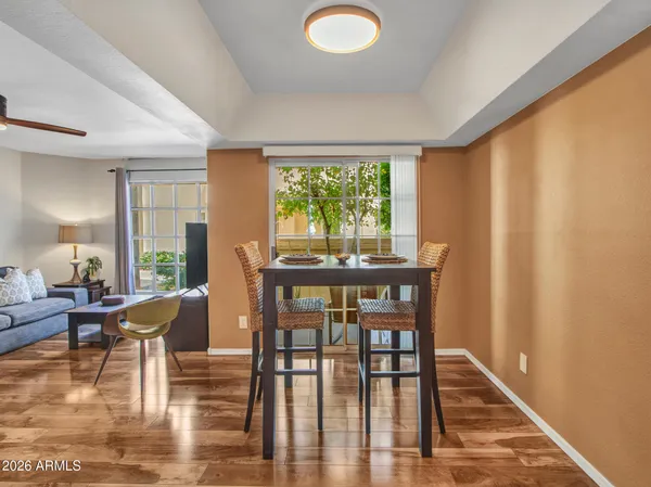 a kitchen with stainless steel appliances granite countertop a stove a sink dishwasher a refrigerator and a microwave oven with cabinets