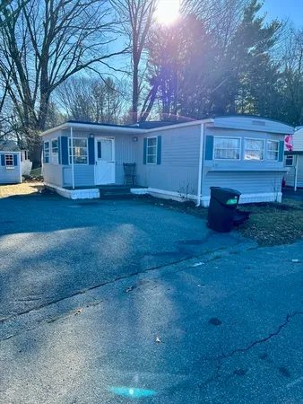 a view of a house with a back yard