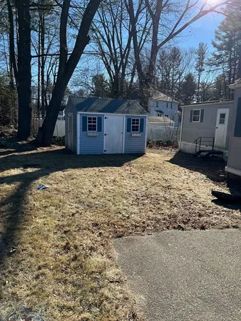 a view of a room with furniture and a window