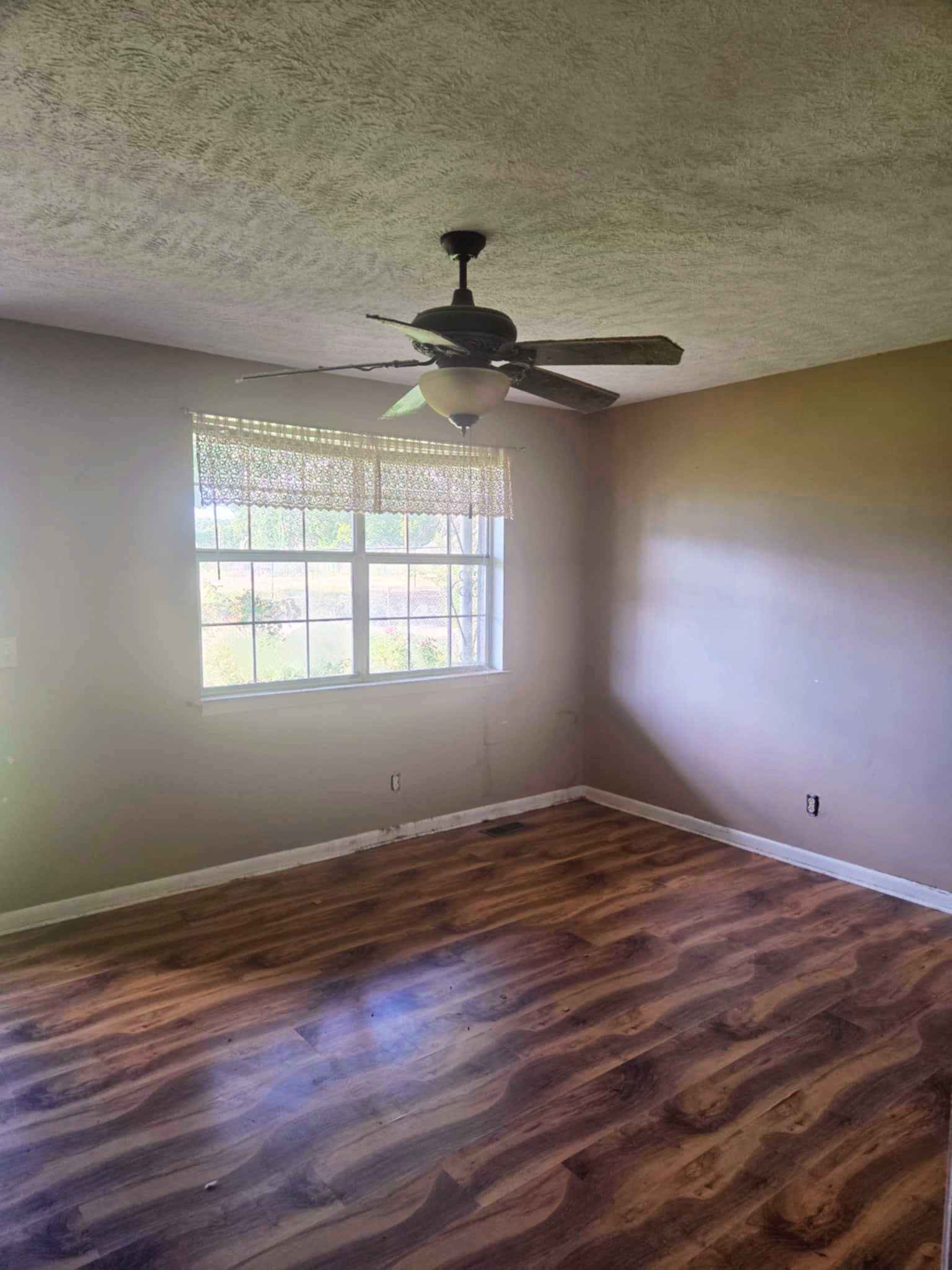 203 East 22nd Avenue Springfield, TN 37172 - Photo 2 of 8 a view of empty room with wooden floor and fan