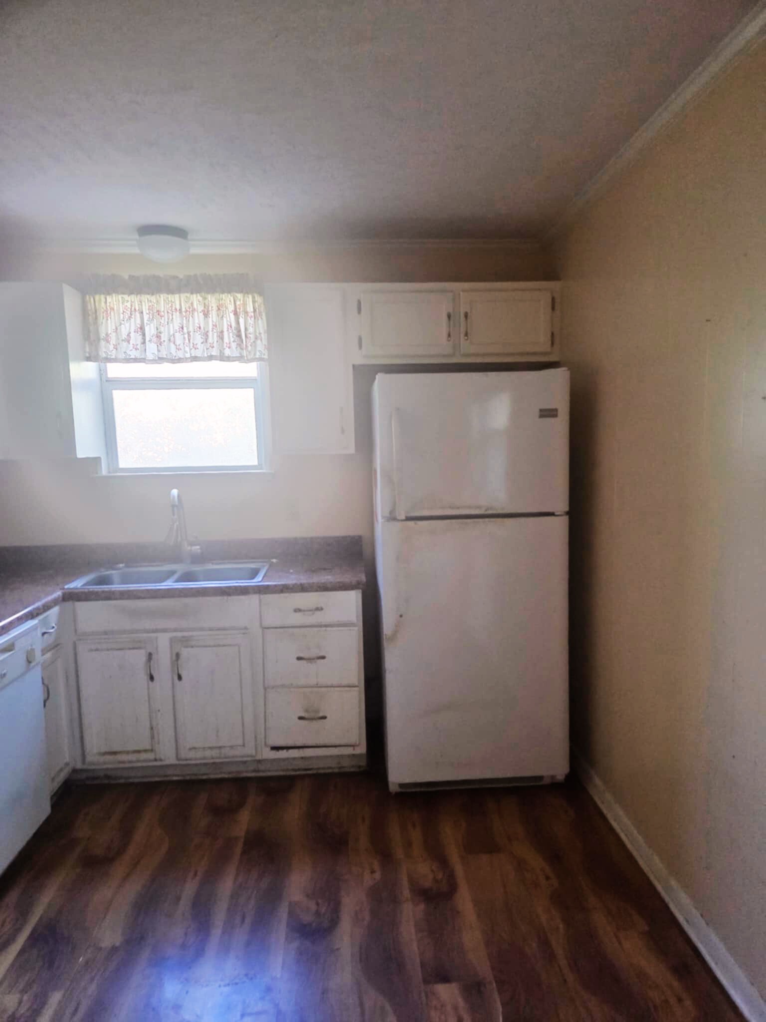 203 East 22nd Avenue Springfield, TN 37172 - Photo 4 of 8 a kitchen with cabinets appliances wooden floor and a window