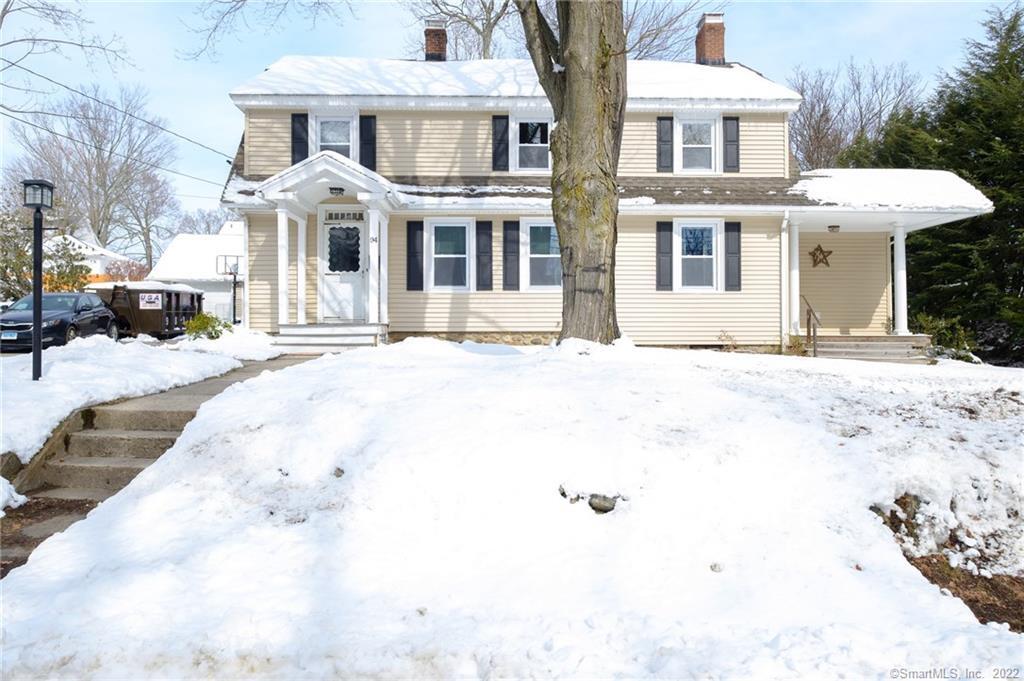 a front view of a building with a yard