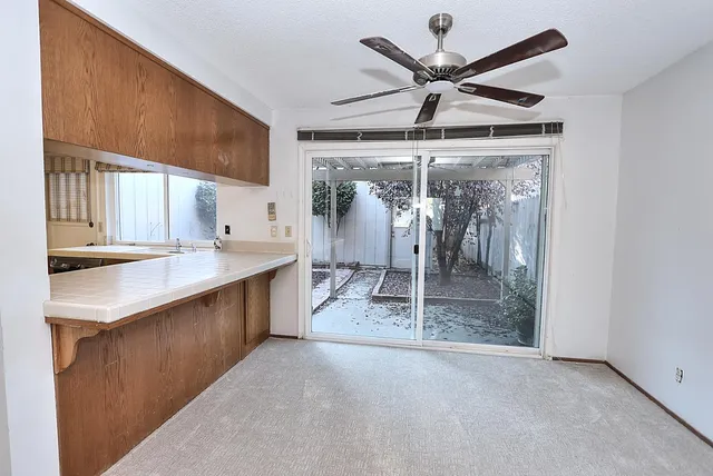 a view of a house with a yard porch and sitting area
