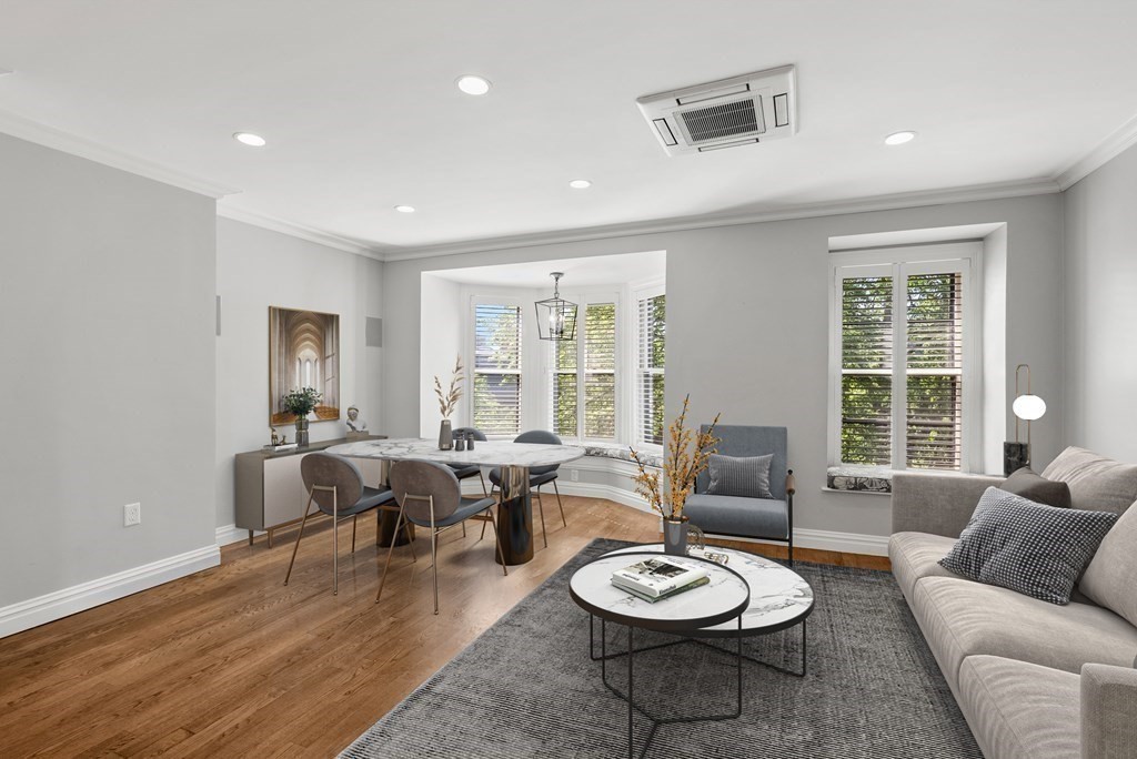 75 Montgomery Street, Unit 4 Boston, MA 02116 - Photo 5 of 14 a living room with furniture and a wooden floor