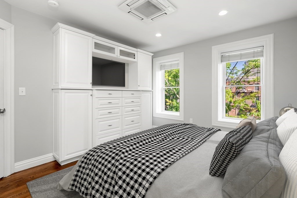 75 Montgomery Street, Unit 4 Boston, MA 02116 - Photo 7 of 14 a bedroom with a bed and a window