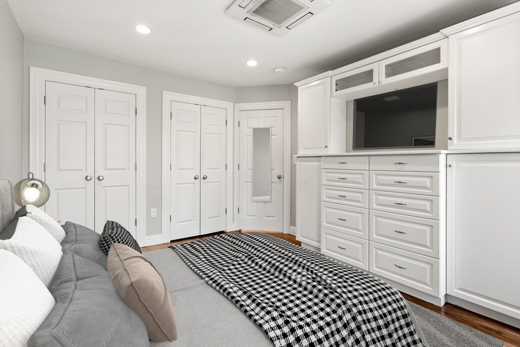 75 Montgomery Street, Unit 4 Boston, MA 02116 - Photo 8 of 14 a bedroom with a bed and a television