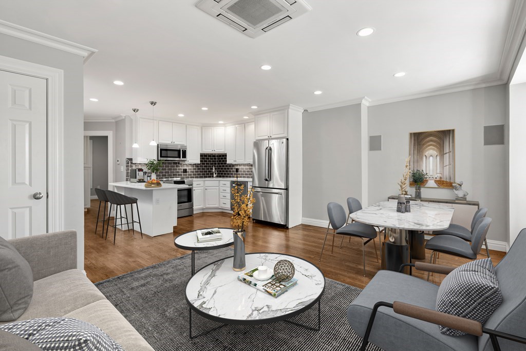 75 Montgomery Street, Unit 4 Boston, MA 02116 - Photo 9 of 14 a dining room with furniture a table and kitchen view