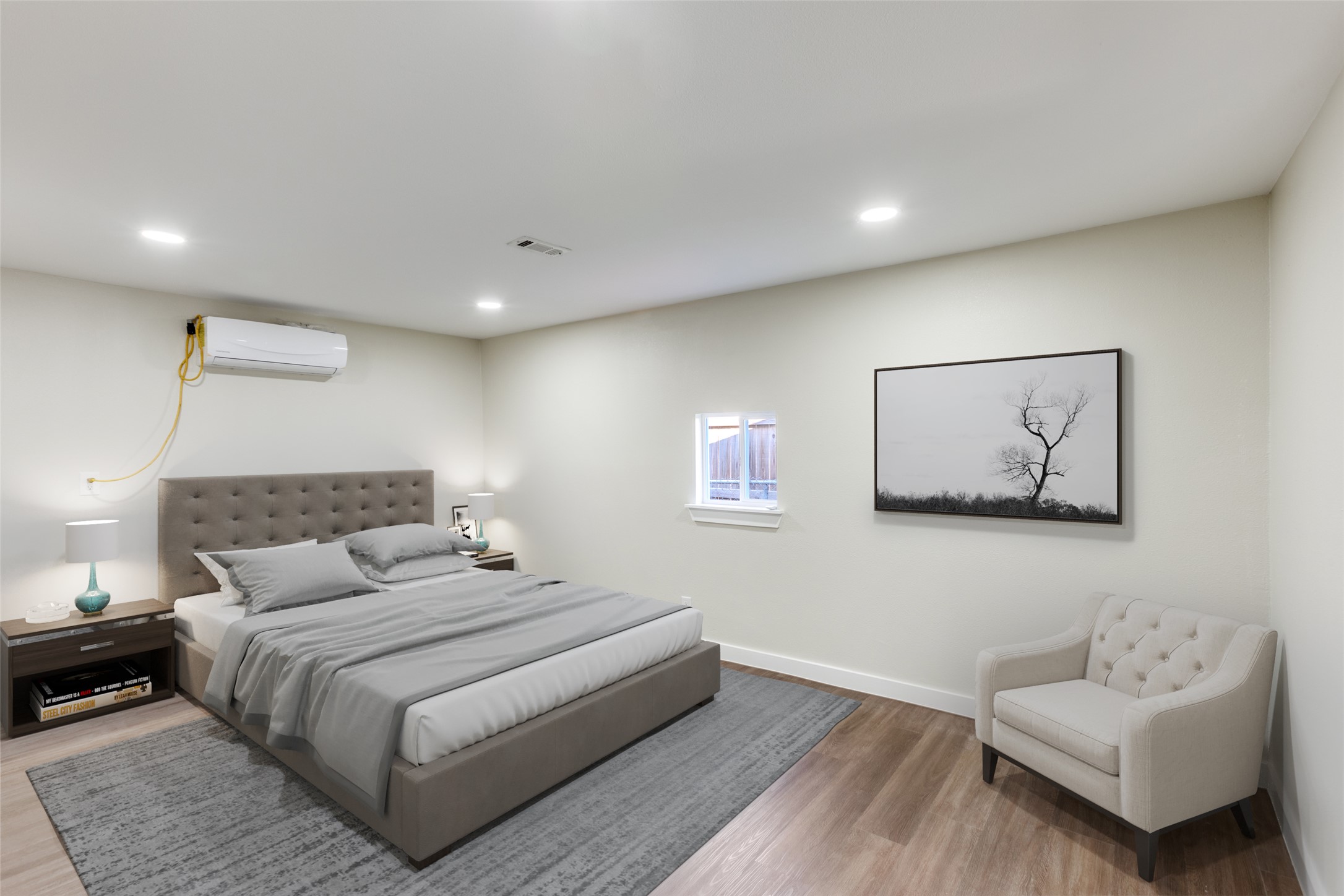 1118 Spur Street Austin, TX 78721 - Photo 6 of 21 Virtually staged. Recessed lighting and warm wood flooring create a comfortable and inviting atmosphere in this bedroom.