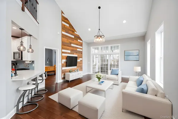 a view of entryway with wooden floor and stairs