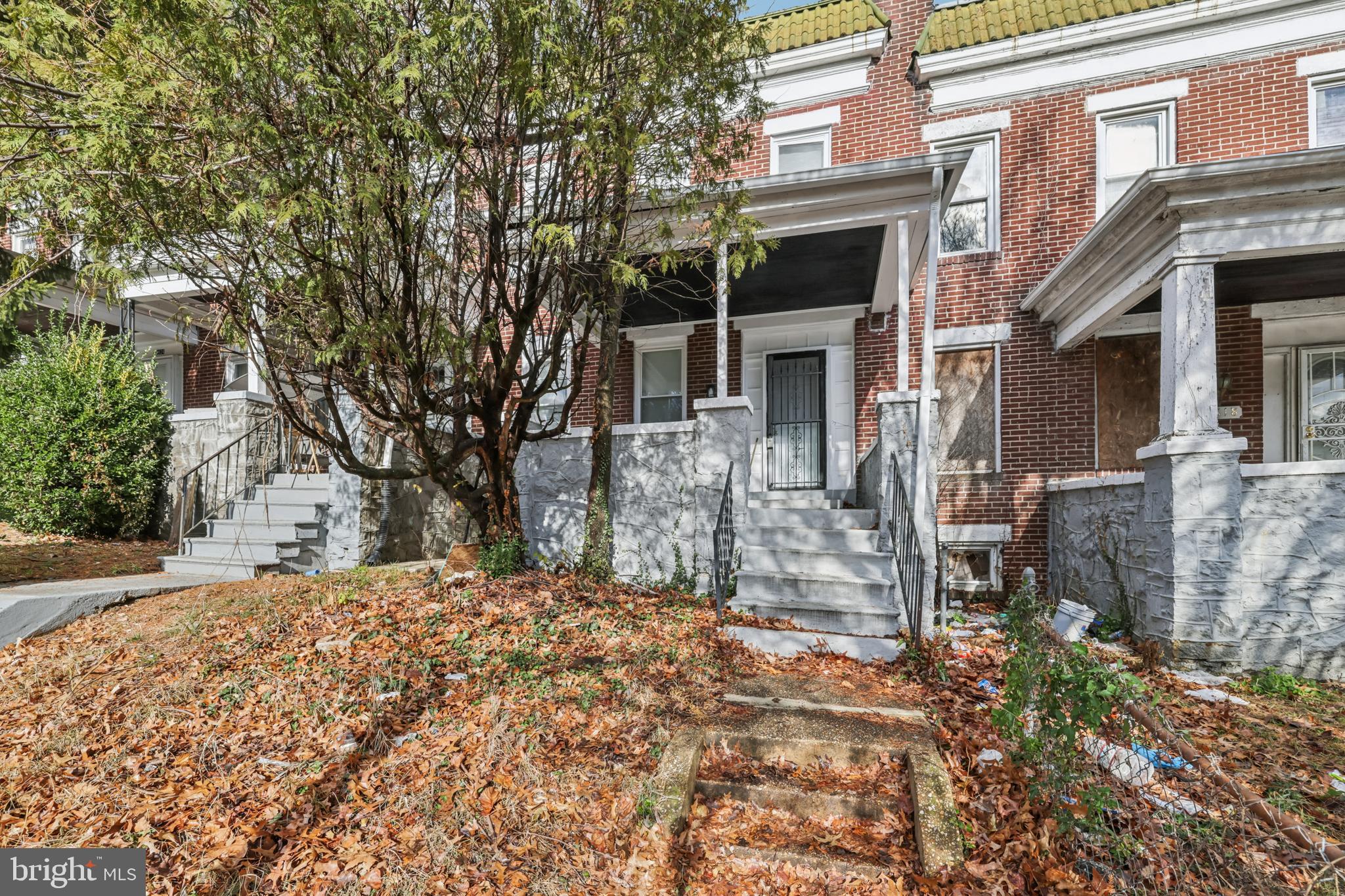 2820 Brighton Street Baltimore, MD 21216 - Photo 1 of 38 a view of a house with a snow on the wall
