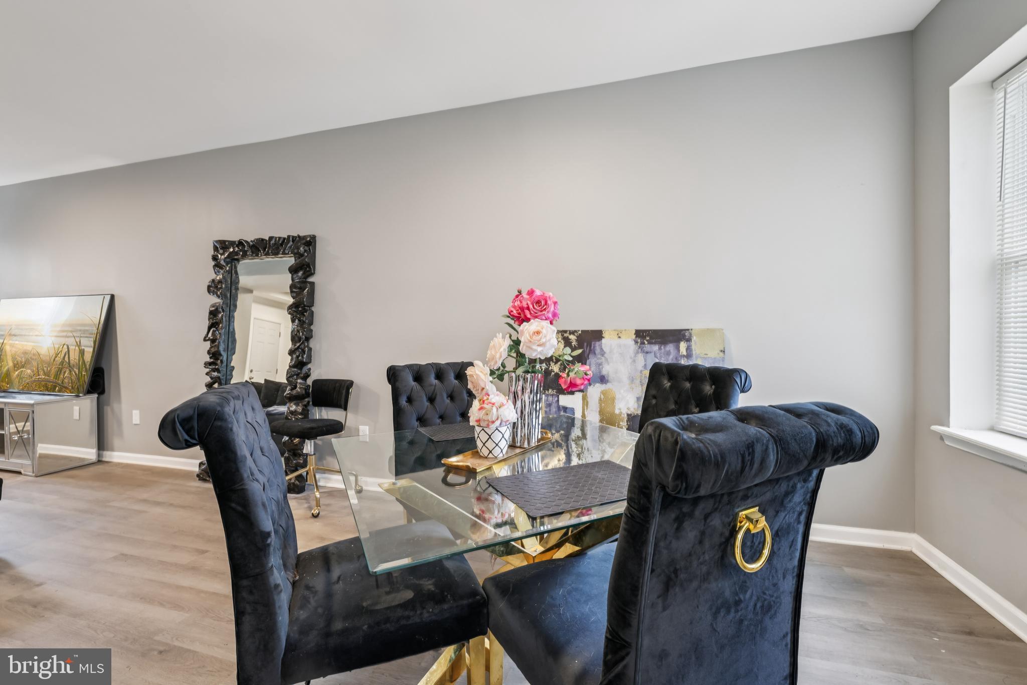 2820 Brighton Street Baltimore, MD 21216 - Photo 11 of 38 a view of a dining room with furniture and wooden floor